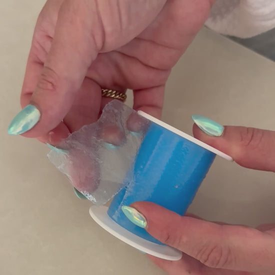 Tearing a perforated piece off the silicone mouth tape roll