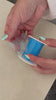 Tearing a perforated piece off the silicone mouth tape roll